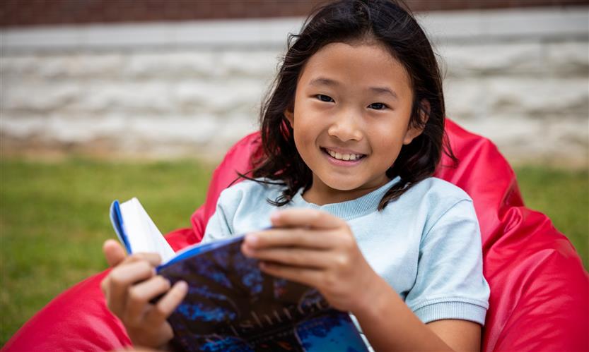 Students read books outside